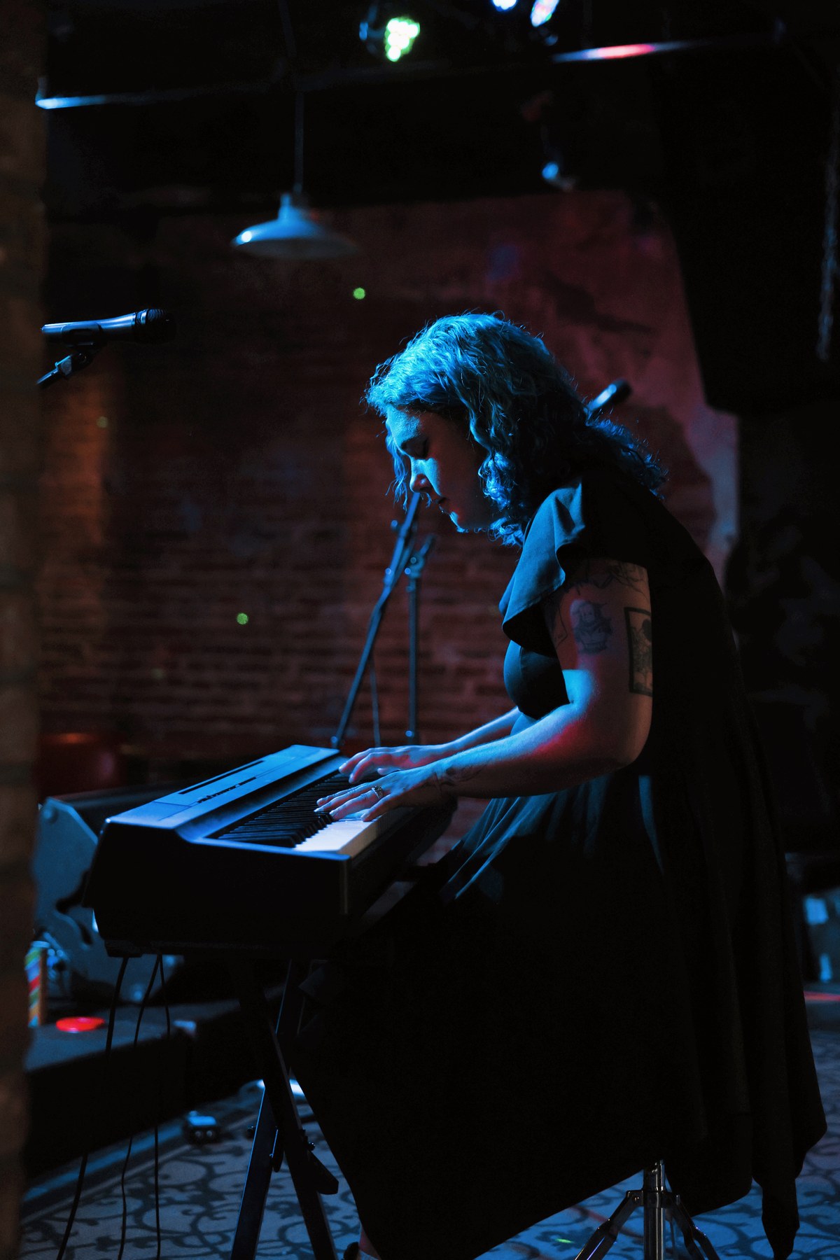 Faye at the keys during a live show